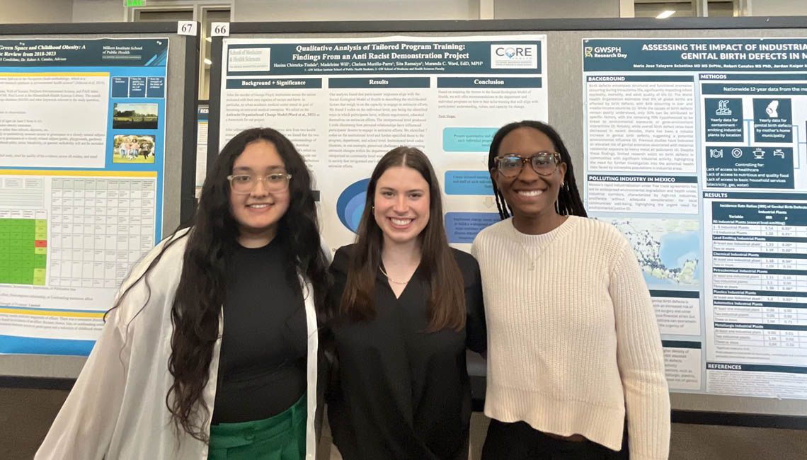 student with research poster